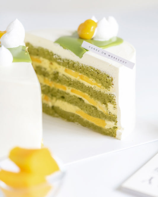 Matcha Mango Cake with matcha sponge, mango fresh cream, fresh mango slices, Chantilly cream & matcha ganache