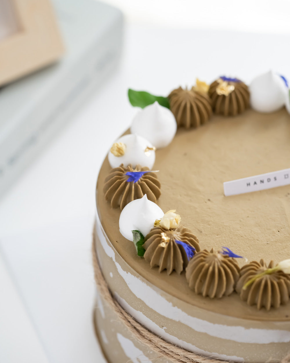 Closeup of decoration on top of Hojicha Matcha Cream Cake