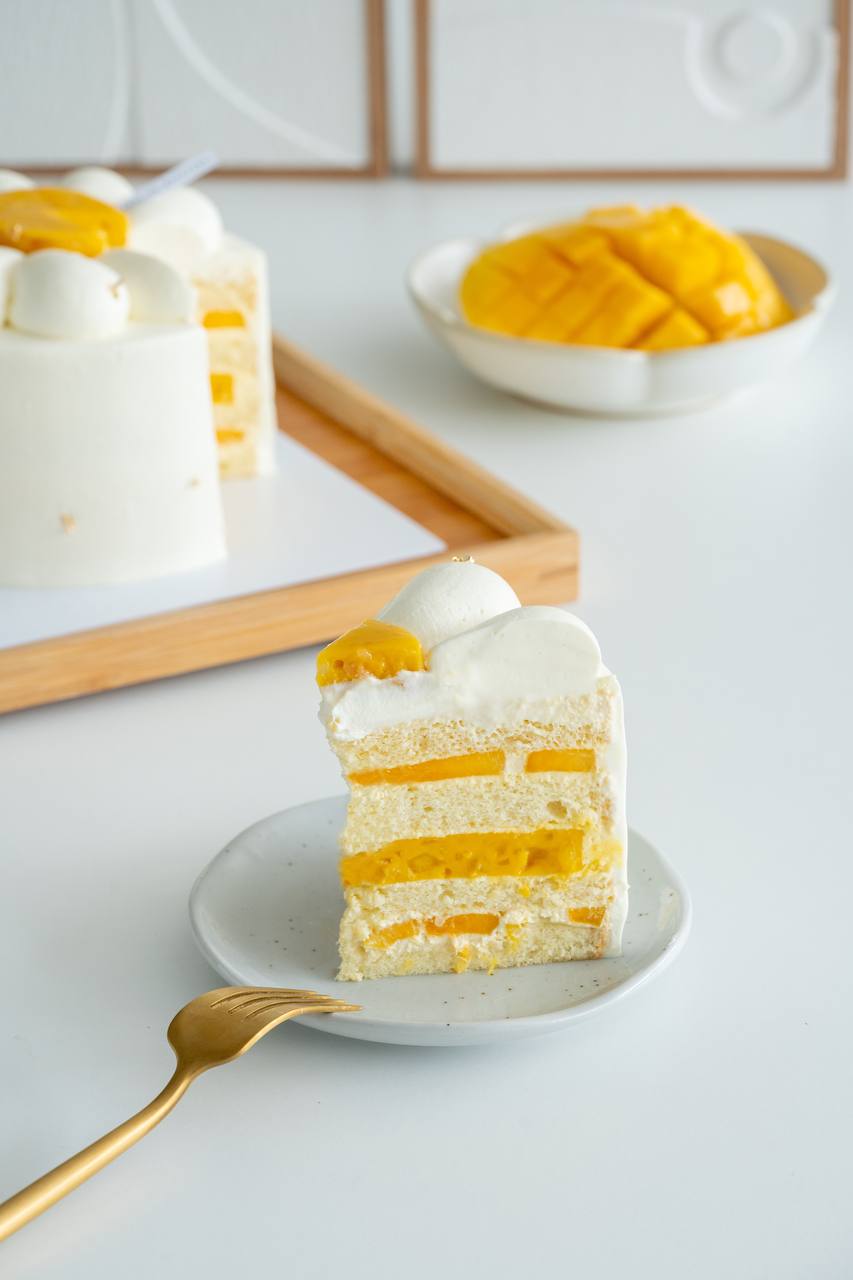 Mango pomelo fresh cream cake slice