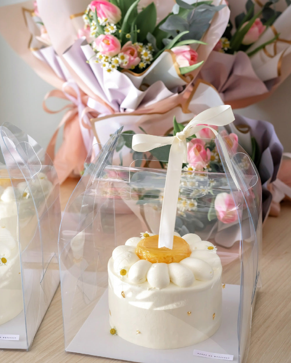 Pomelo Mango Fresh Cream Cake packaged in transparent cake box