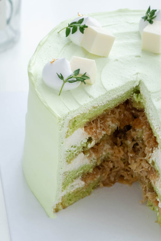 Ondeh Ondeh Cake - Pandan Coconut Cake with Pandan Sponge Cake,  Caramelized Gula Melaka,  Fresh Coconut Flakes,  Pandan Whipping Cream & Coconut Jelly Cubes Topping