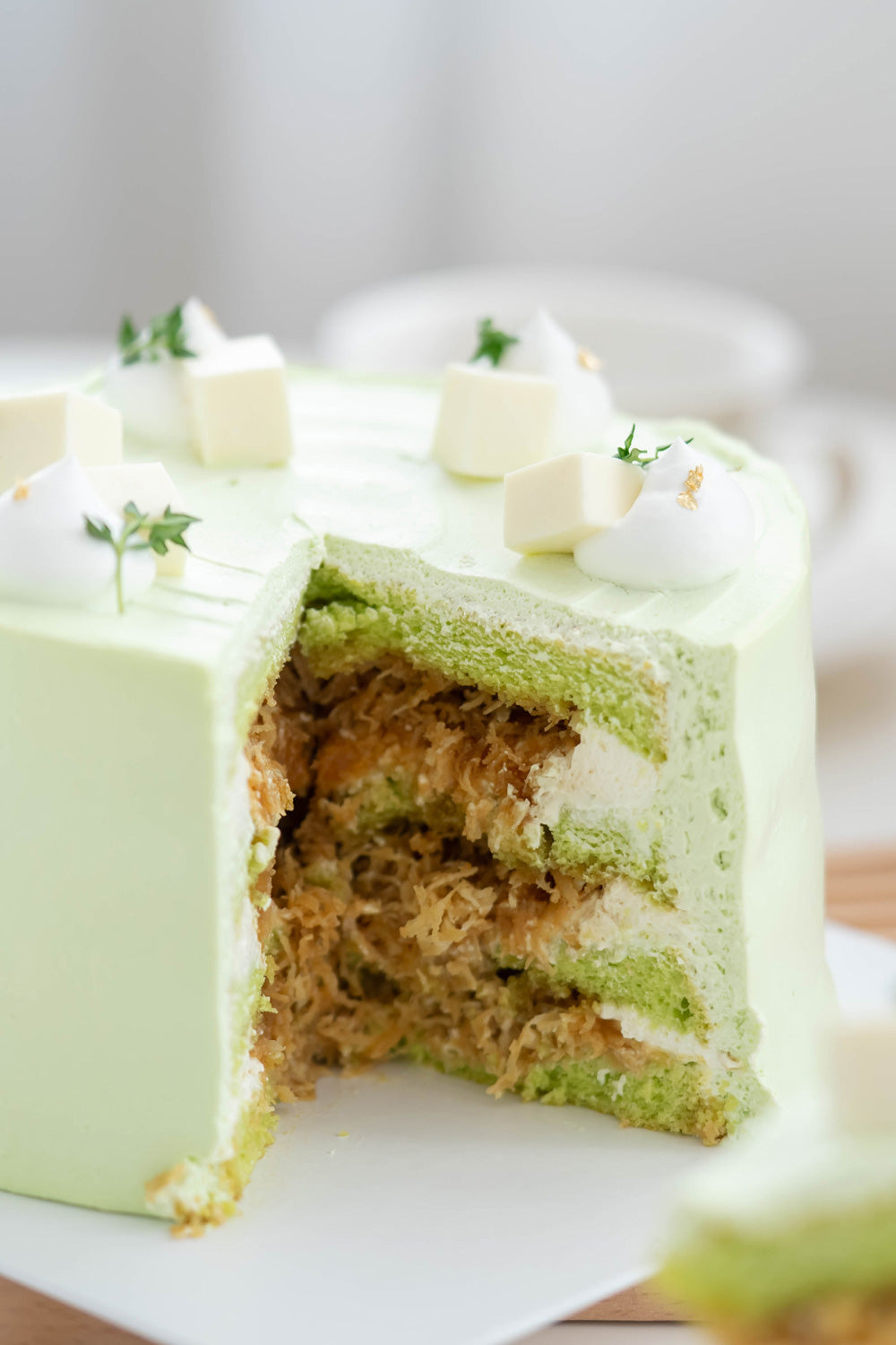 Ondeh Ondeh Cake - Pandan Coconut Cake with Pandan Sponge Cake,  Caramelized Gula Melaka,  Fresh Coconut Flakes,  Pandan Whipping Cream & Coconut Jelly Cubes Topping